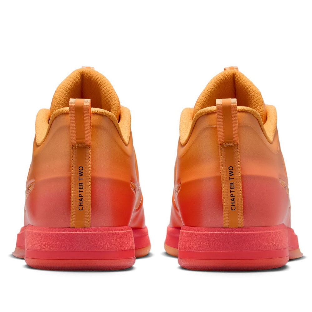 Nike sneakers heel view with orange padded collar and "CHAPTER TWO" webbing straps