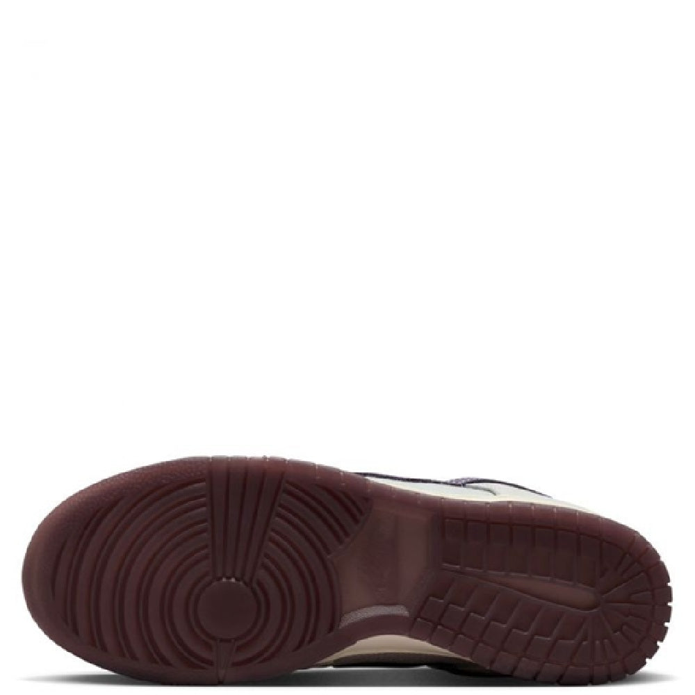 Nike Dunk Low Retro SE rubber outsole, dark maroon tread pattern.