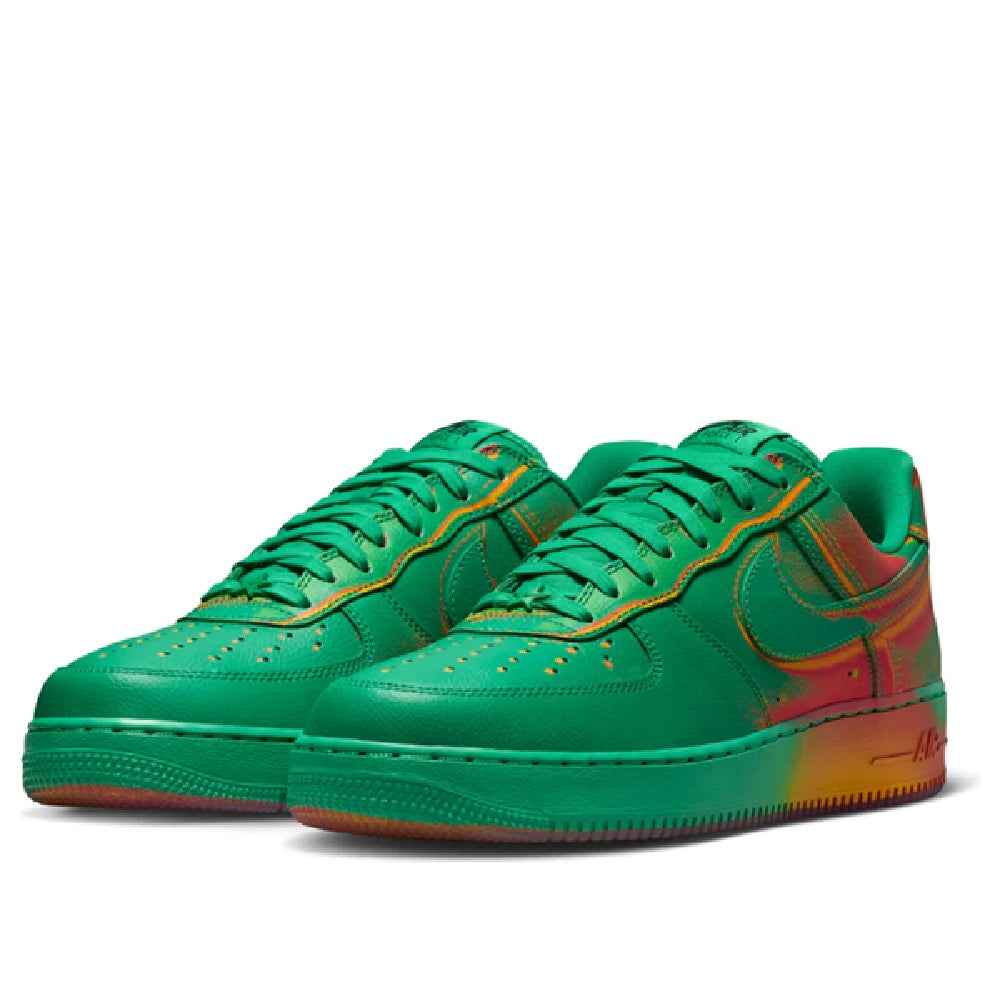 Green Nike Air Force 1 Low sneakers pair with red heel panels and orange trim sole