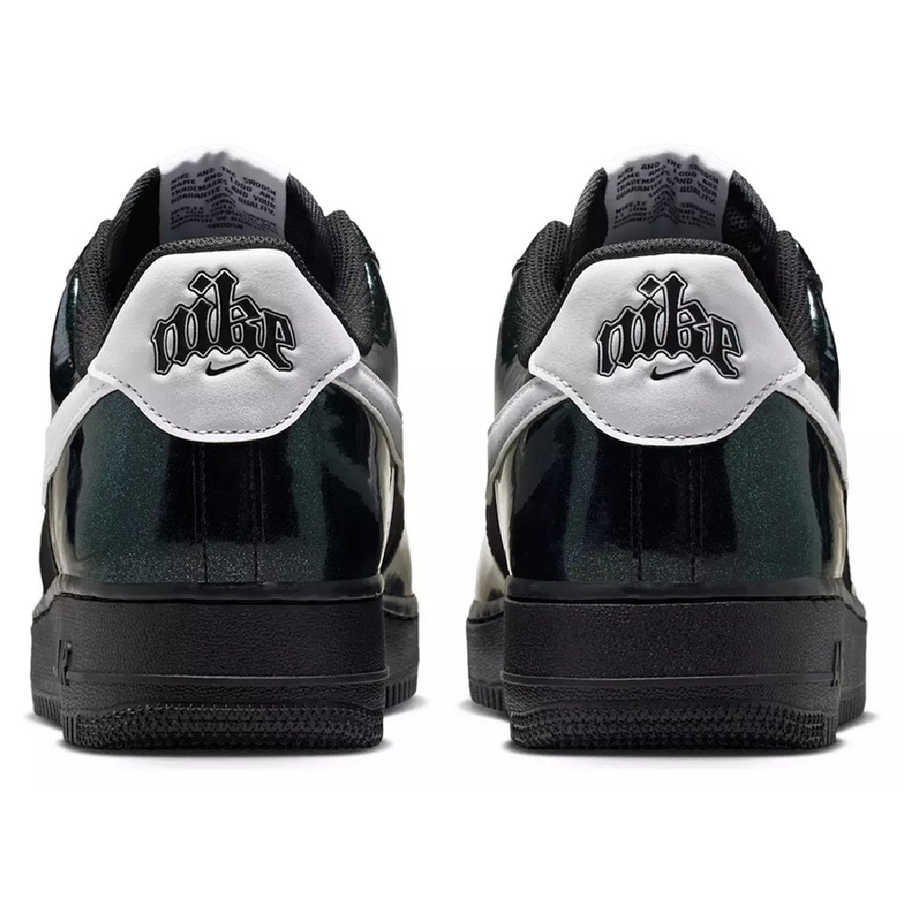 Nike AF1 low-top heel view with black back panel, white logo patch, and black outsole