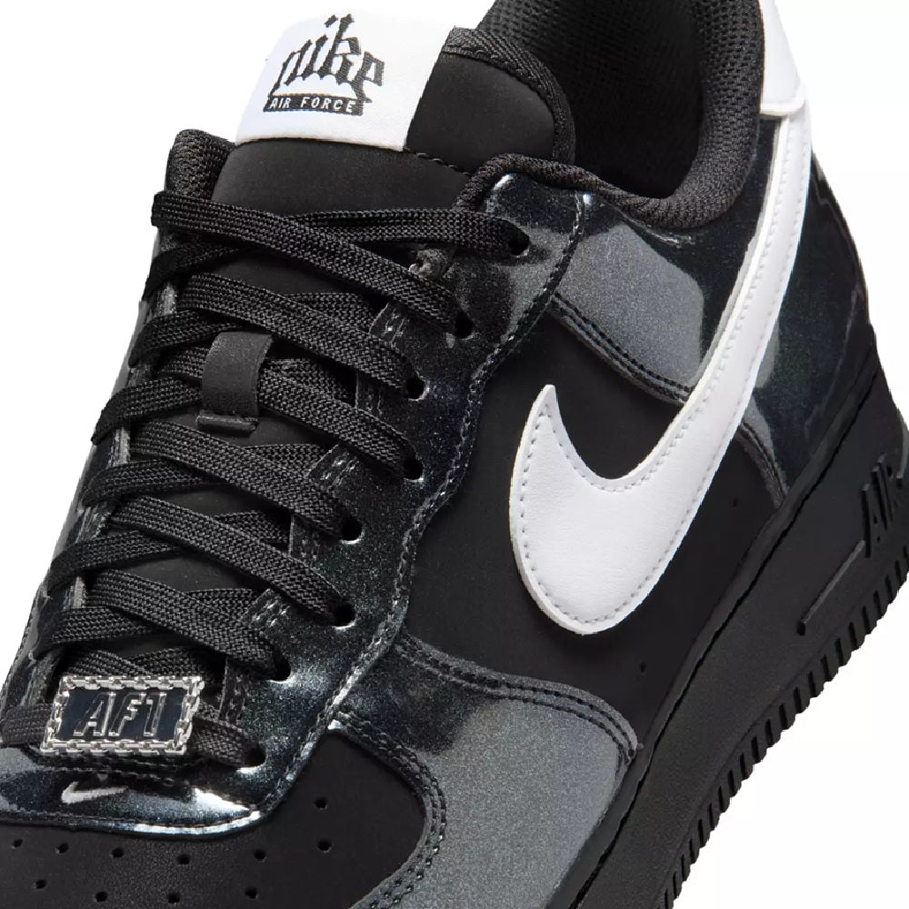 Nike AF1 low-top close-up: black laces, white Swoosh, and textured leather panels