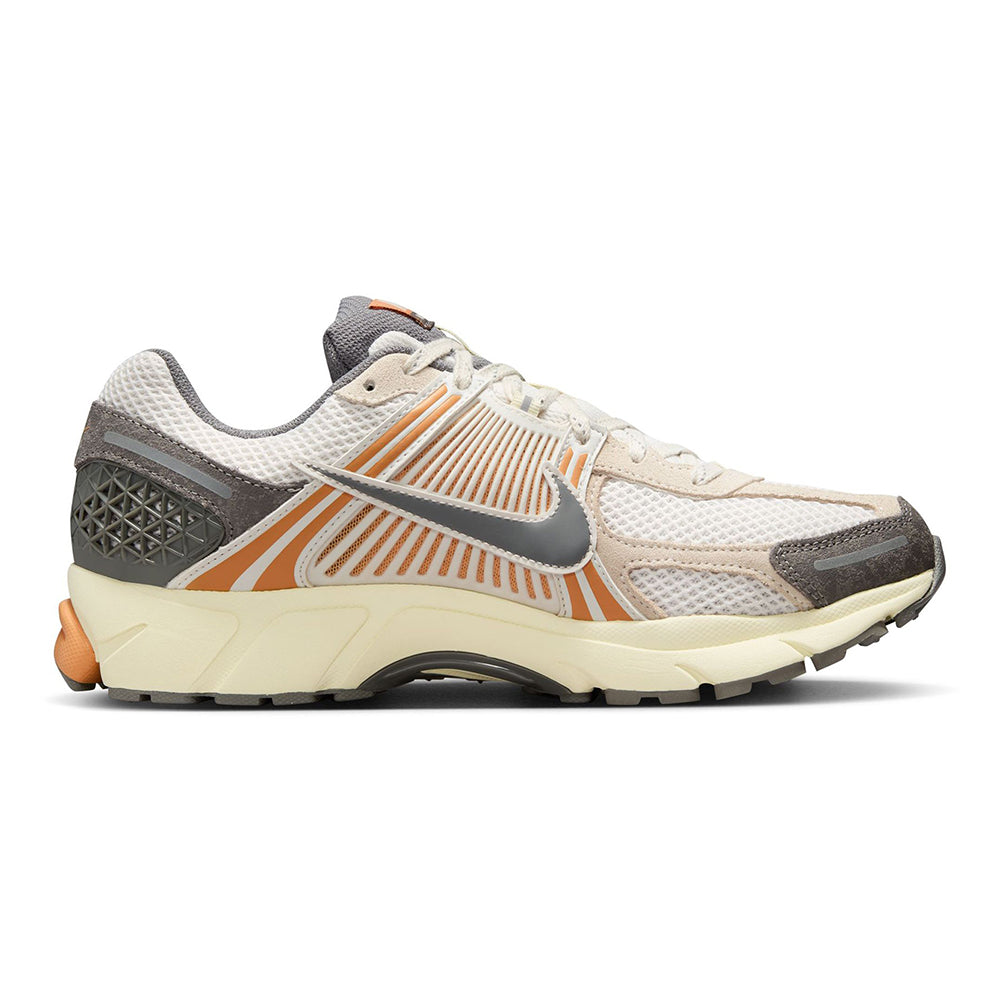 Nike Zoom Vomero 5 sneakers in light mesh with orange accents and dark gray heel panel