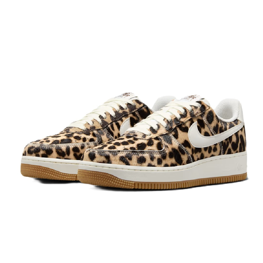 Pair of women's Nike Air Force 1 sneakers with leopard print and gum sole