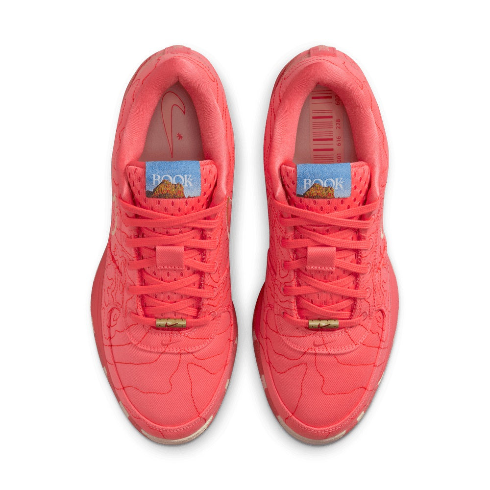 Red men's Nike sneakers, front view with laces and tongue branding