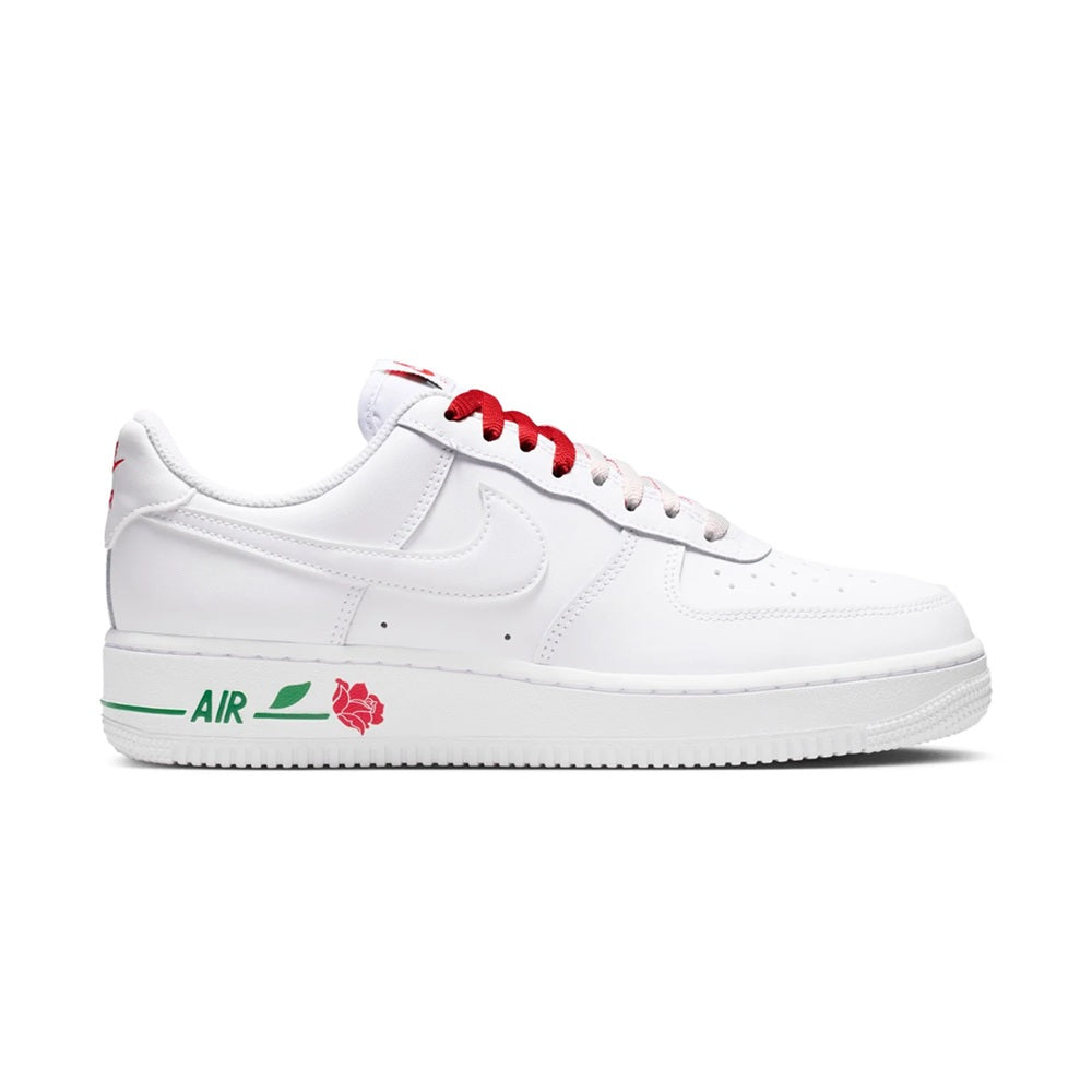 White low-top sneakers with red laces and rose graphic on side, green midsole stripe