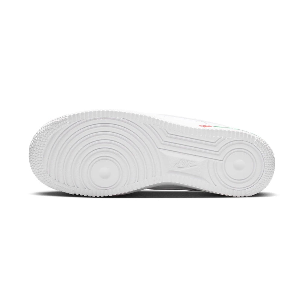 White rubber outsole with circular tread pattern and raised traction grips