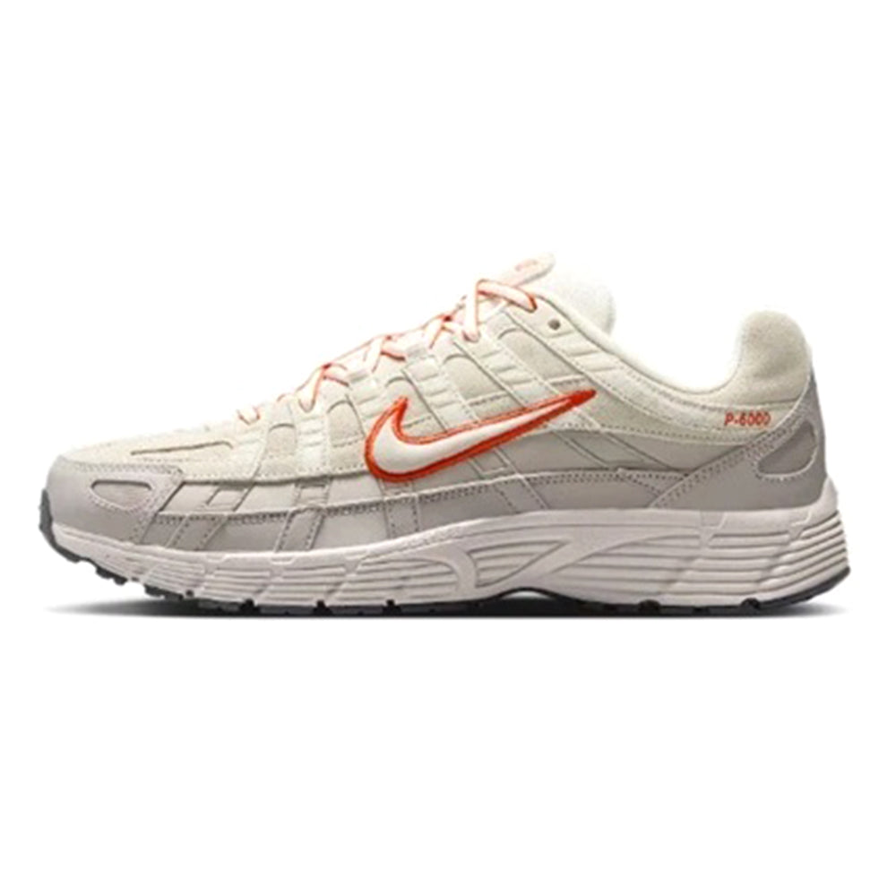 White and gray running sneakers with orange swoosh, red piping, and lace-up upper