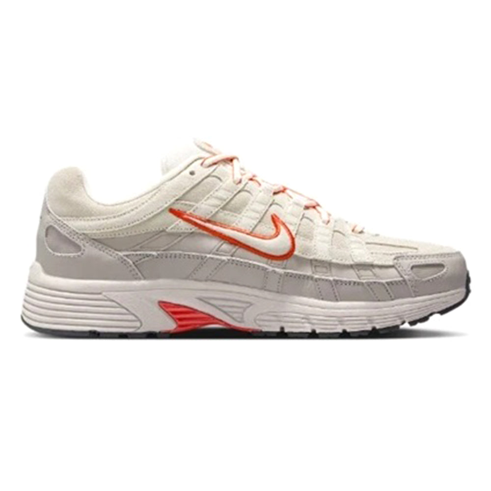 Men's white and gray athletic sneakers with orange swoosh and red lace accents