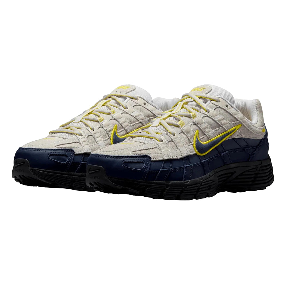 Men's Nike P-6000 PRM sneakers, front view with off-white upper, navy overlays, yellow laces