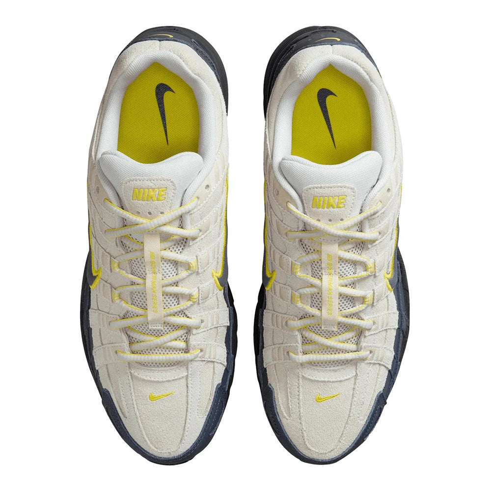 Men's Nike P-6000 PRM sneakers, white pair with yellow insoles and NIKE logo on tongue