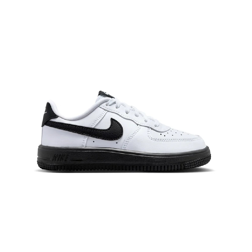Kids' white and black low-top sneakers with black Nike swoosh and lace-up design