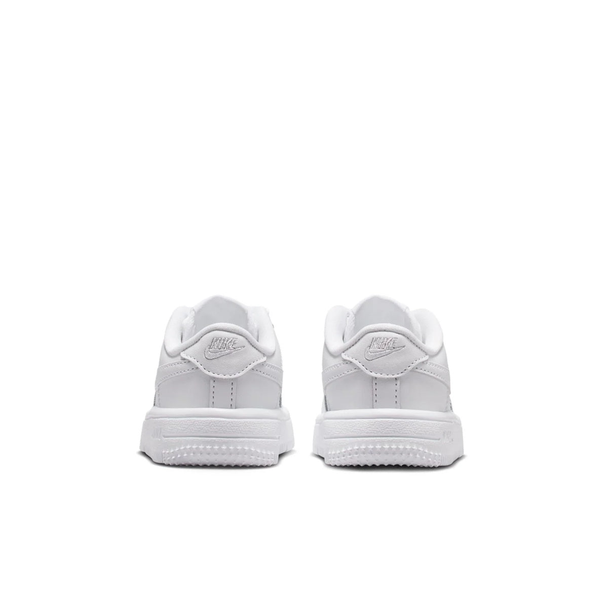 Kids' Nike low-top sneakers, white leather, rear view with heel tab and swoosh