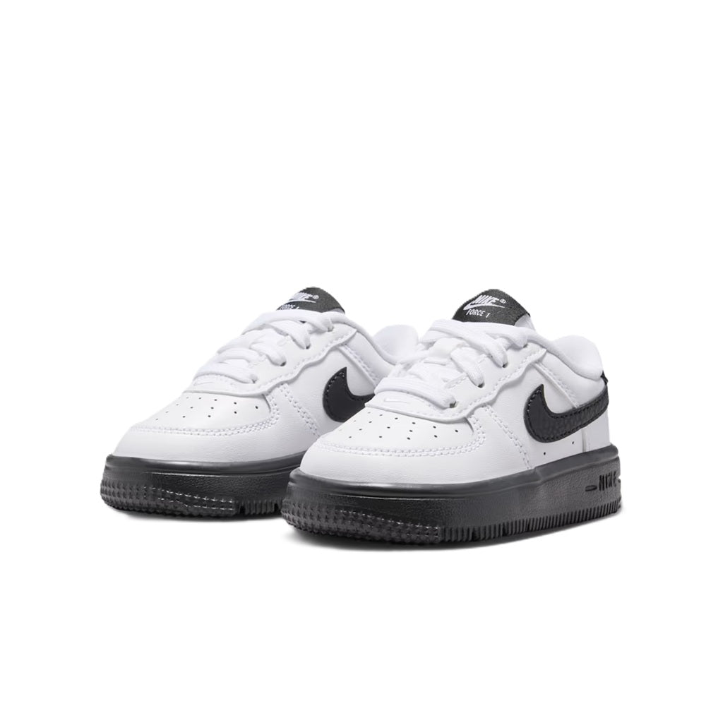 Toddler Nike Force 1 Low lace sneakers pair, white with black swooshes and dark soles