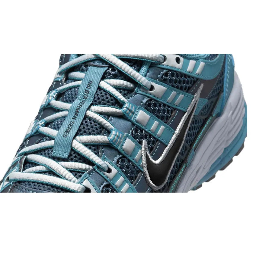 Women’s Nike P-6000 SE sneaker close-up, turquoise laces, black mesh, swoosh
