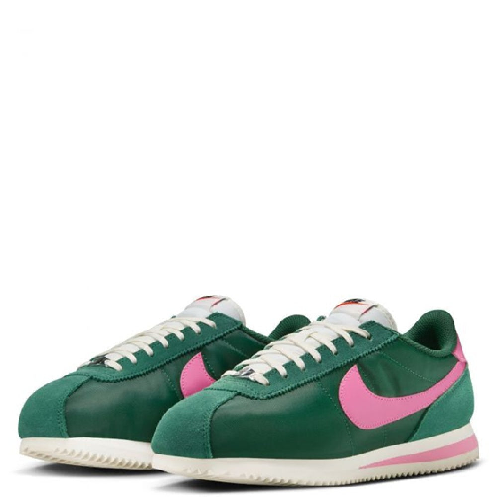 Nike Cortez sneakers pair, green uppers with pink swoosh and white laces