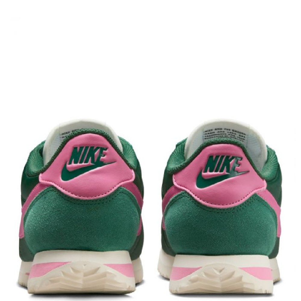 Nike Cortez sneakers heel view, green suede with pink heel tab and Nike logo