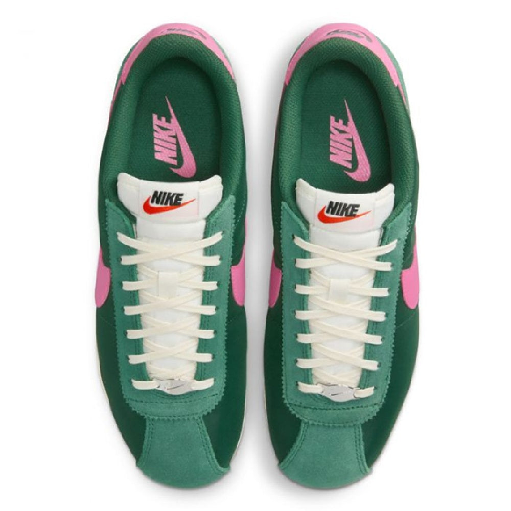 Nike Cortez sneakers top view, green uppers with white laces and pink inner collar