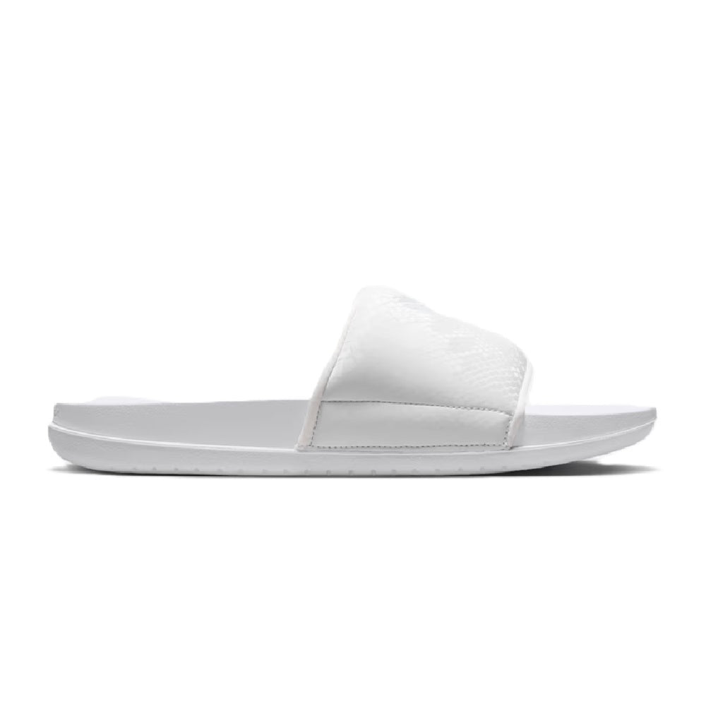 White slide sandal with single wide strap and molded footbed, side view