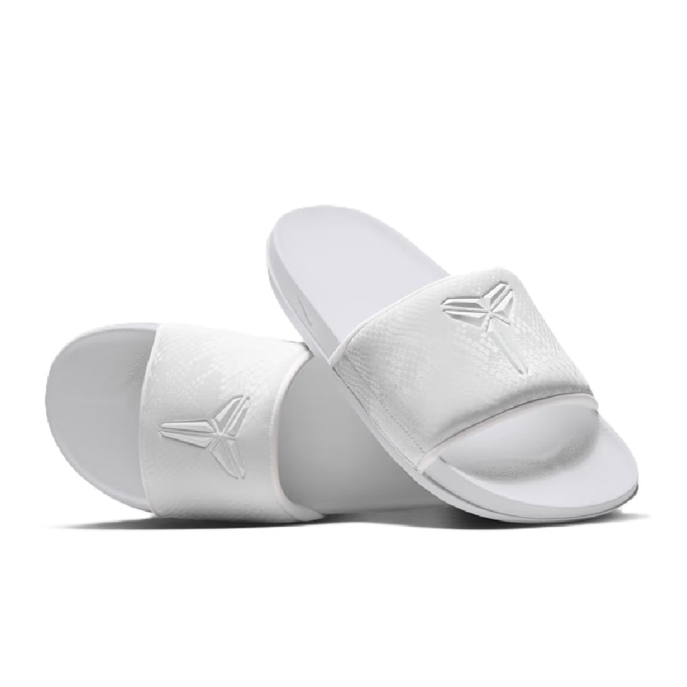 White Nike Kobe slide sandals with embossed forefoot logos, angled view