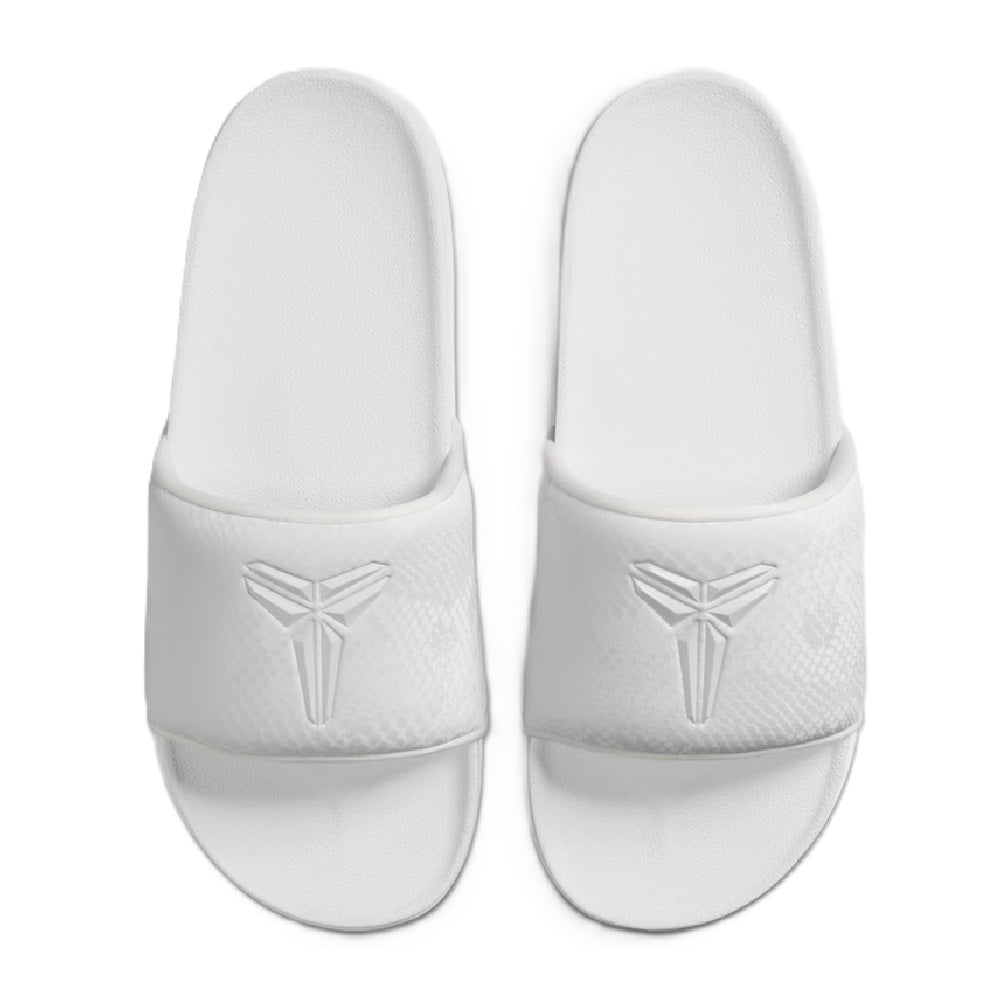 Pair of white slide sandals with Nike Kobe logo on strap and cushioned footbed