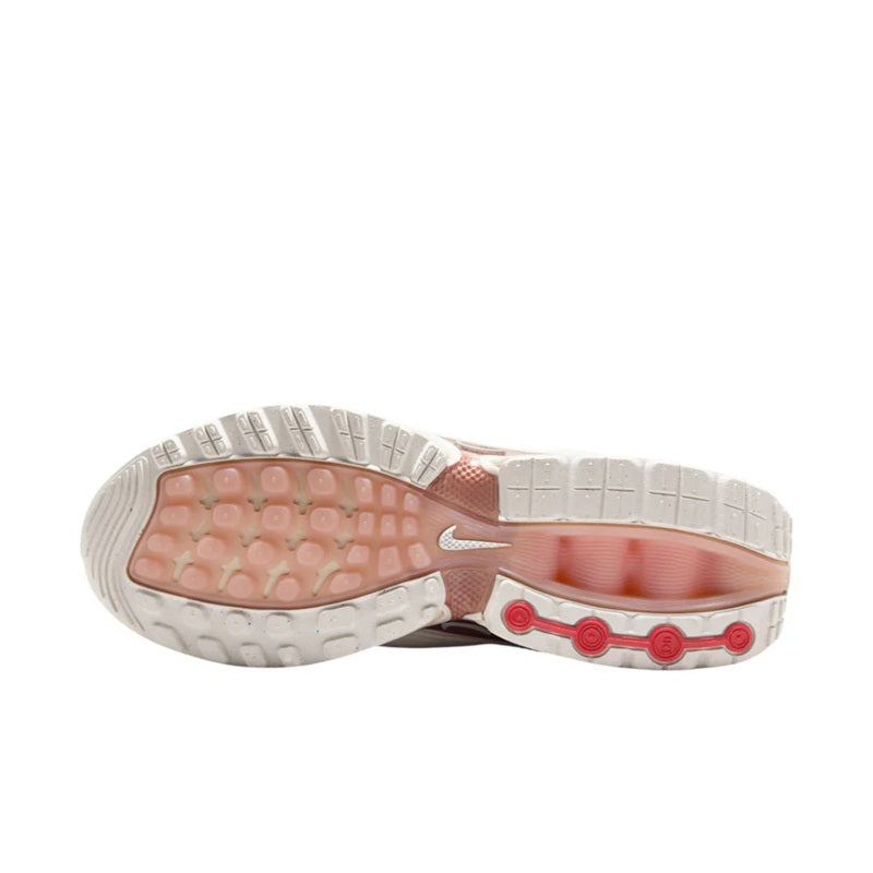 Shoe outsole view with cushioned tread and maroon Air Max cushioning accents