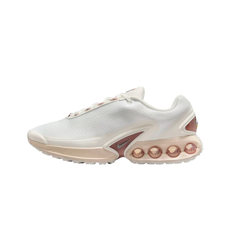 White lace-up running sneaker with visible Air pod outsole and maroon Swoosh