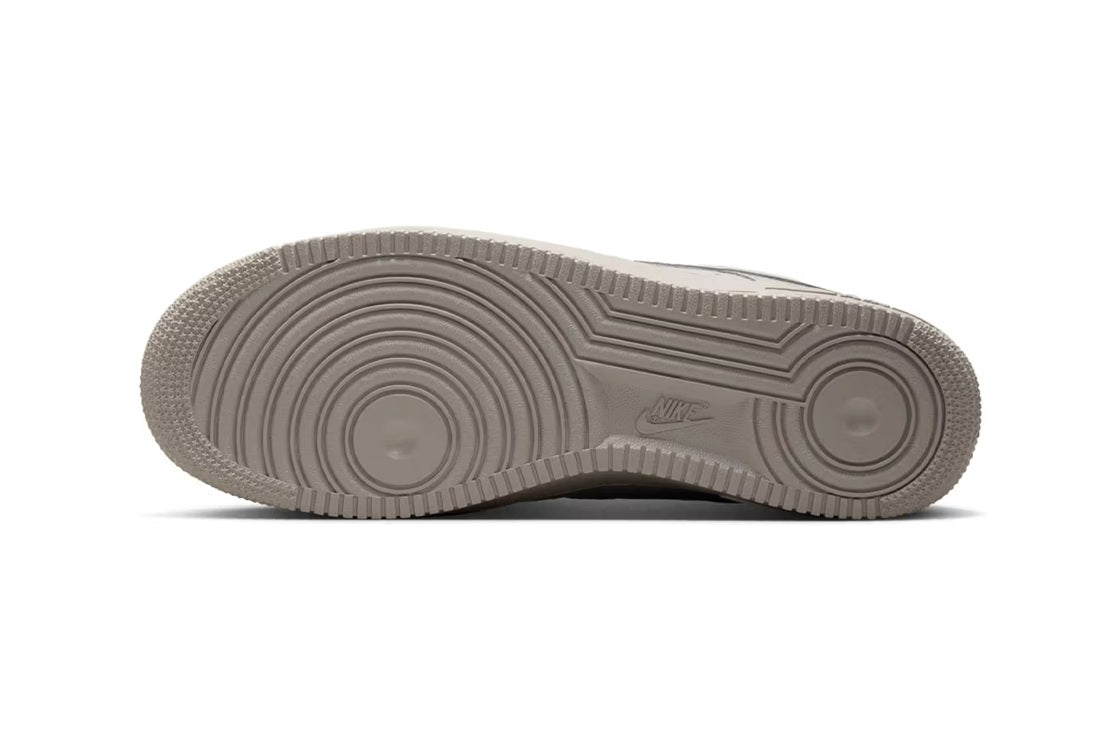 Nike Air Force 1 low-top sneakers outsole in light grey rubber with tread pattern.