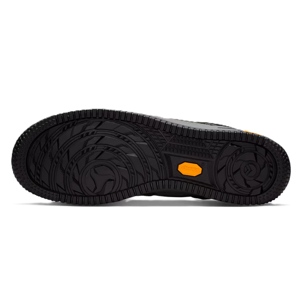 Nike Air Force 1 low-top outsole with textured tread and orange logo accent