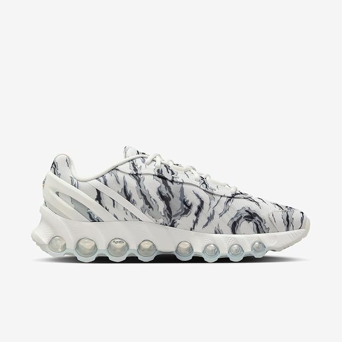 Low-top Nike sneakers, white with dark gray pattern, chunky lace-up sole