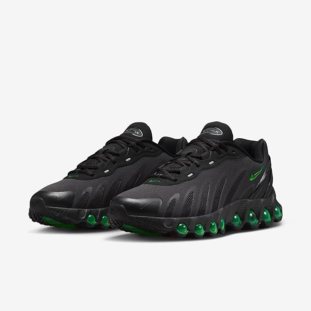 Black low sneaker with green swoosh accents and Air pod sole
