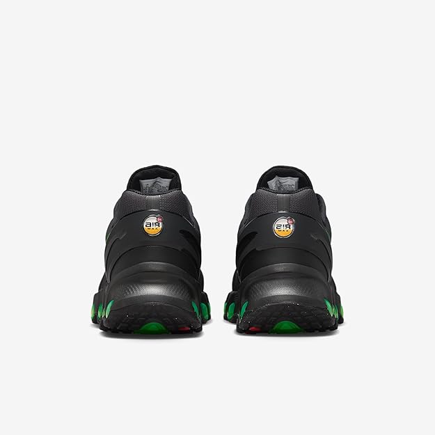 Back view black sneaker with Air logo on heel and green trim along sole
