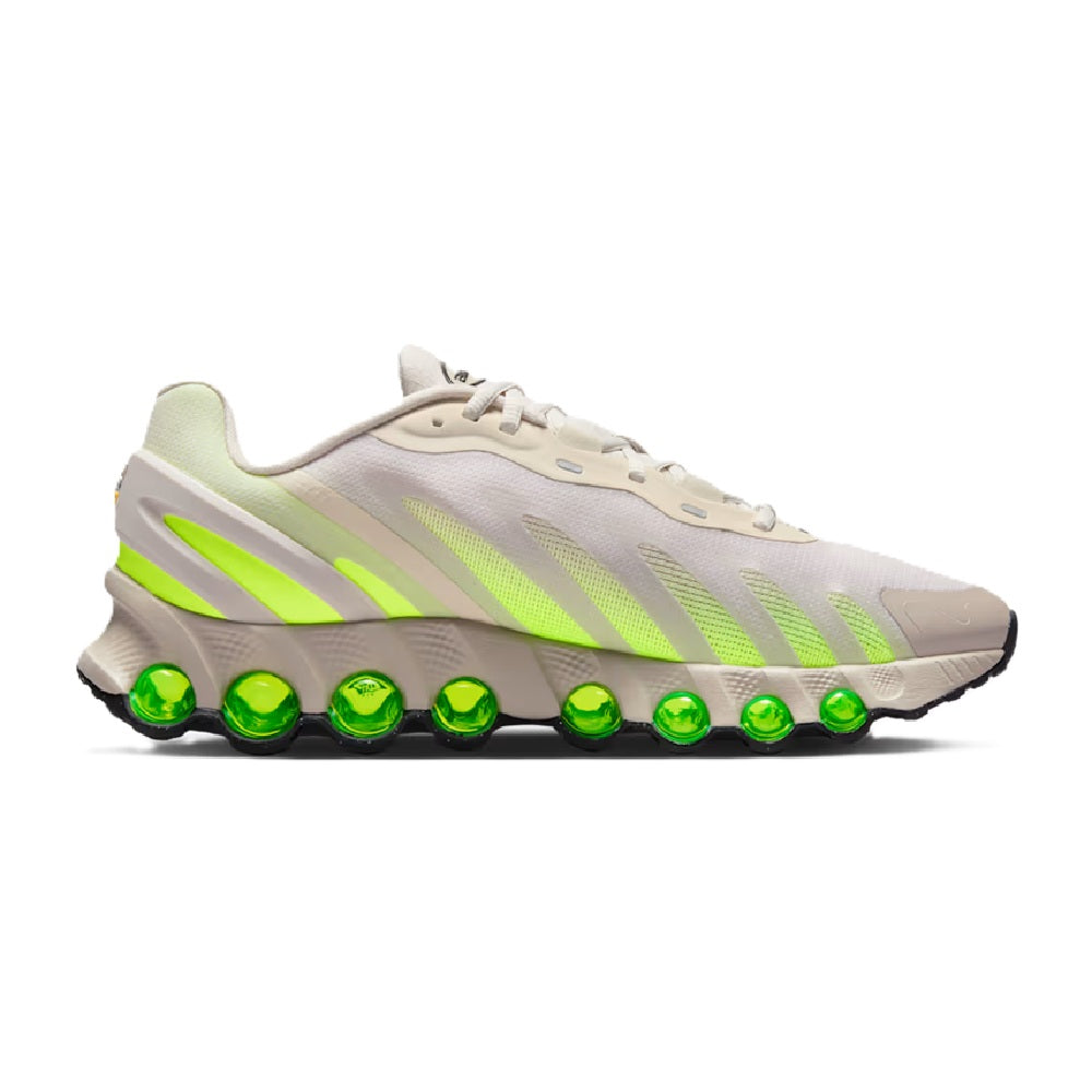 Men's Nike Air Max DN8 sneaker in light brown with neon green stripes and green air pods.