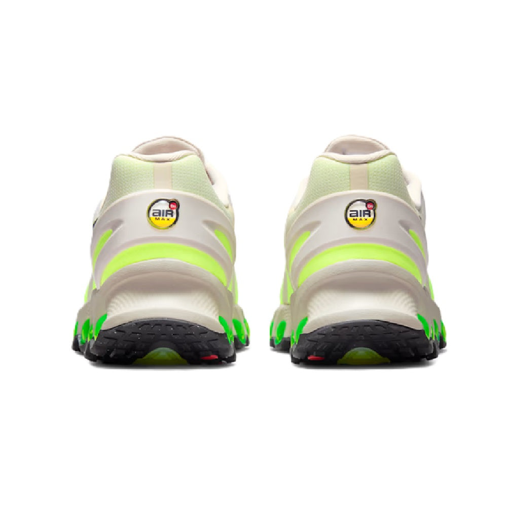 Men's Nike Air Max DN8 heel view, light brown uppers with neon green trim and black sole.
