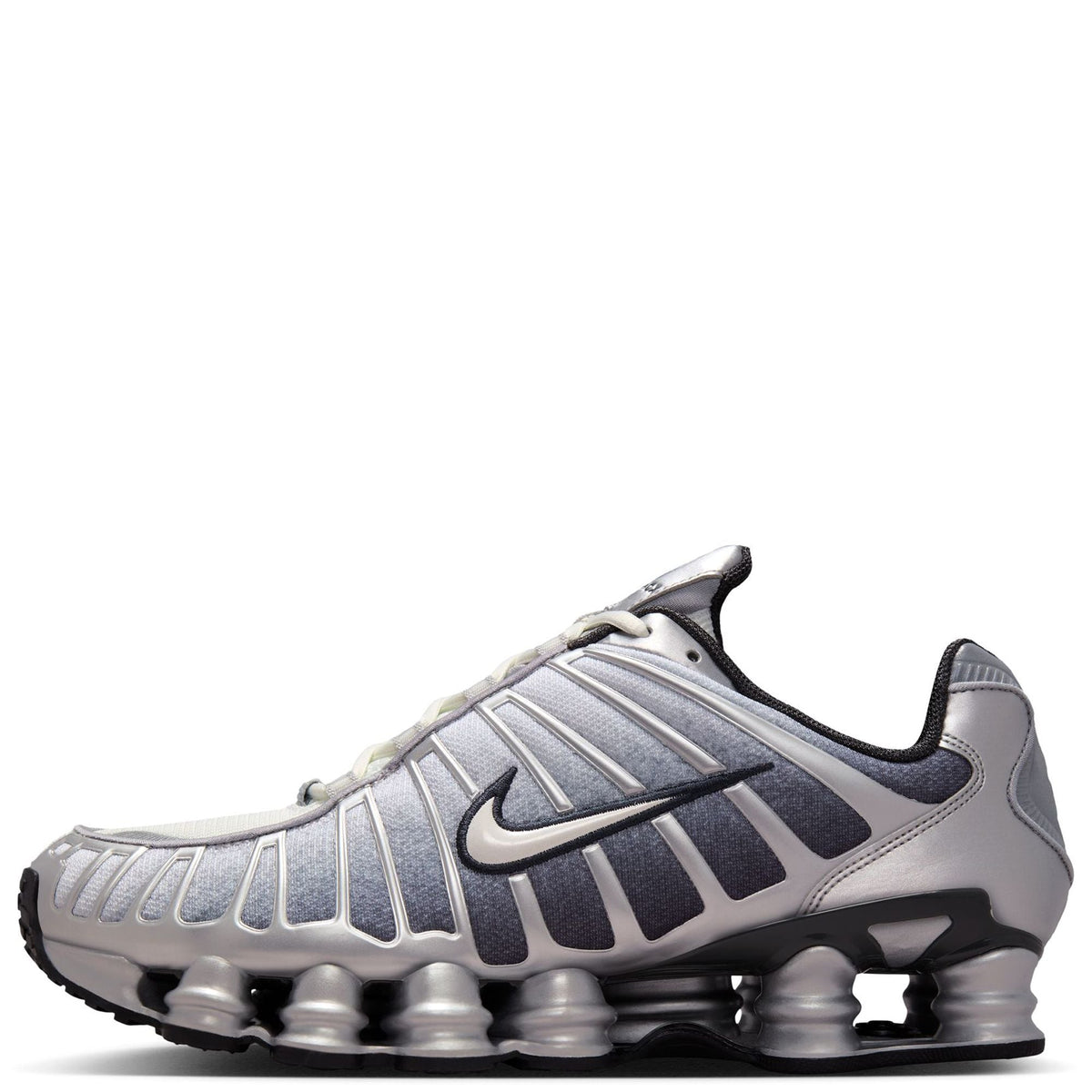 Men's Nike Shox TL metallic silver sneakers with black side stripes and gel-like pods