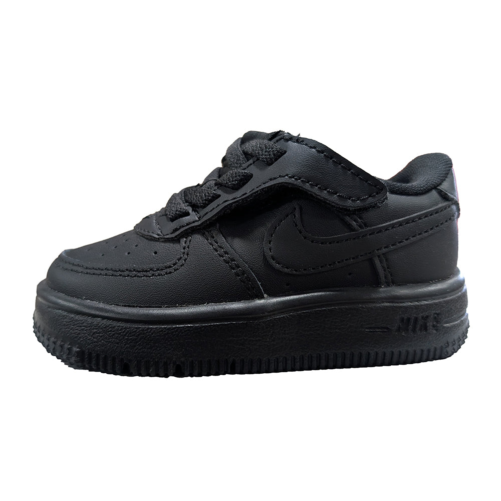 Toddler black low-top sneakers with hook-and-loop strap and Nike swoosh