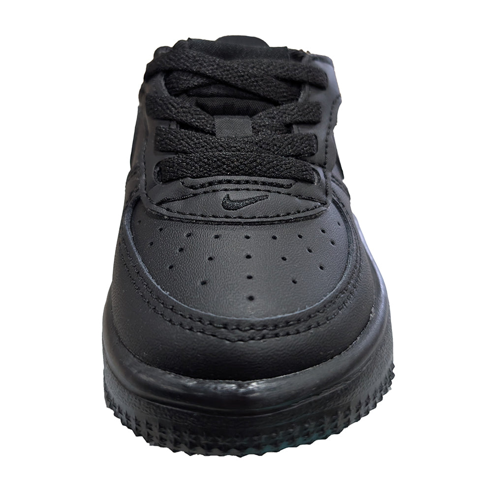 Toddler black low-top sneakers with perforated toe and Nike logo