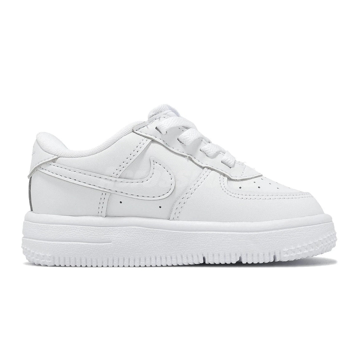 White low-top sneakers side view with Swoosh logo and lace-up closure