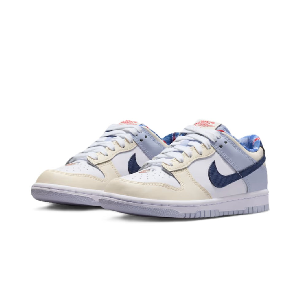 Kids' Nike Dunk Low sneakers, front view of pair with white panels and navy accents