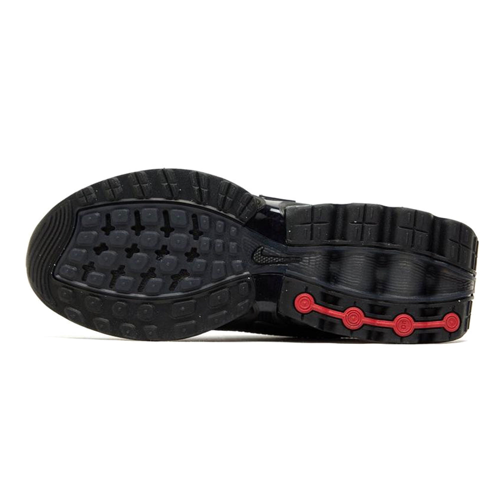 Nike Air Max DN kids black outsole with traction tread and red accent midsole