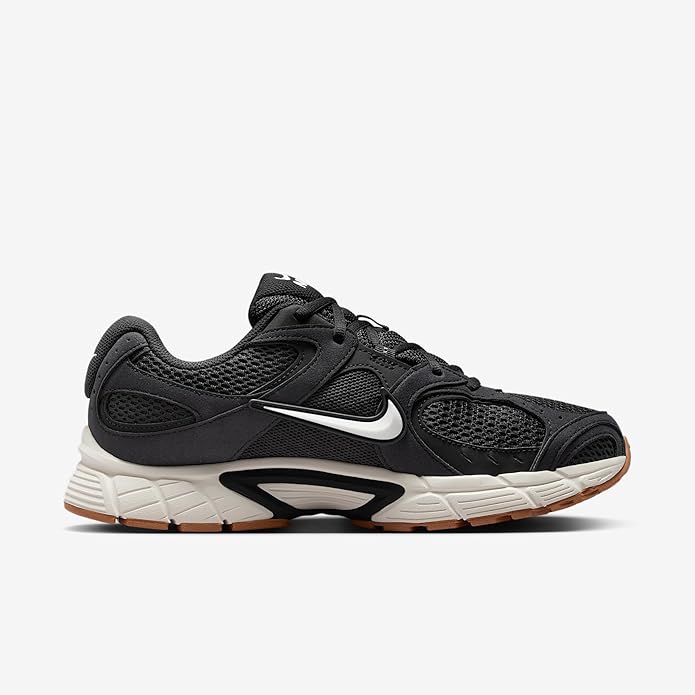 Nike men's running shoes, side view: black upper with white midsole and gum outsole