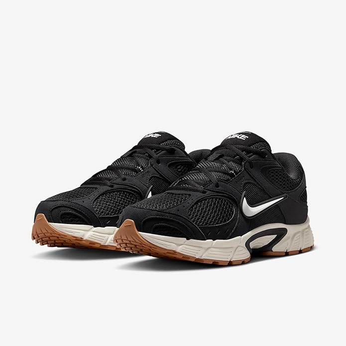 Nike men's running shoes, toe/side angle: black mesh upper, white midsole, gum accents