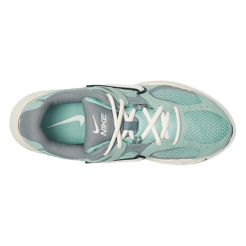 Women's Nike running shoes, side view with mint mesh toe and lace-up front