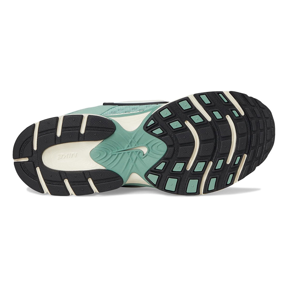 Women's Nike running shoes outsole view with patterned tread and mint insert details