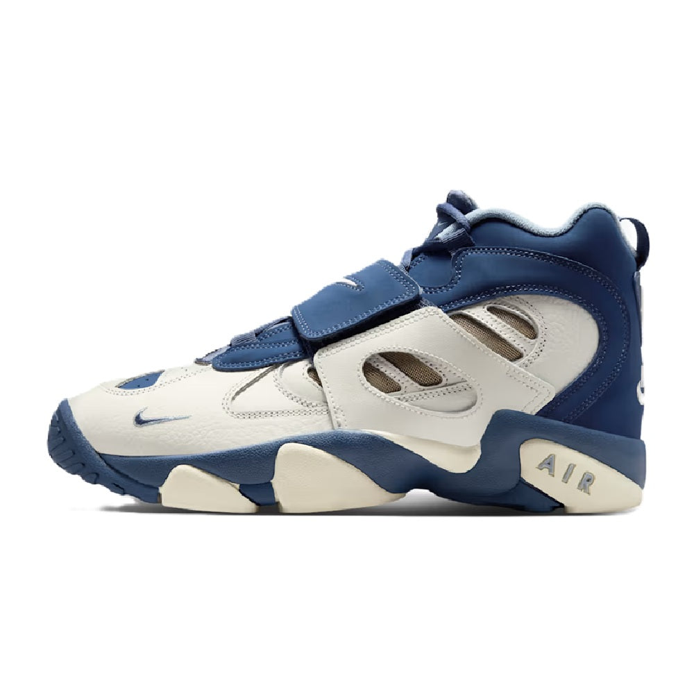 Men's Nike high-top sneakers with velcro strap, off-white panels and navy overlays.