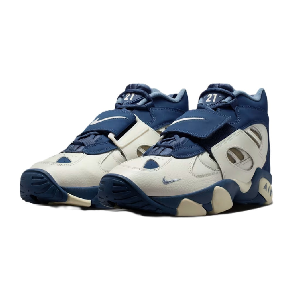 Pair of men's Nike high-top sneakers, off-white uppers with navy overlays and Air detail.
