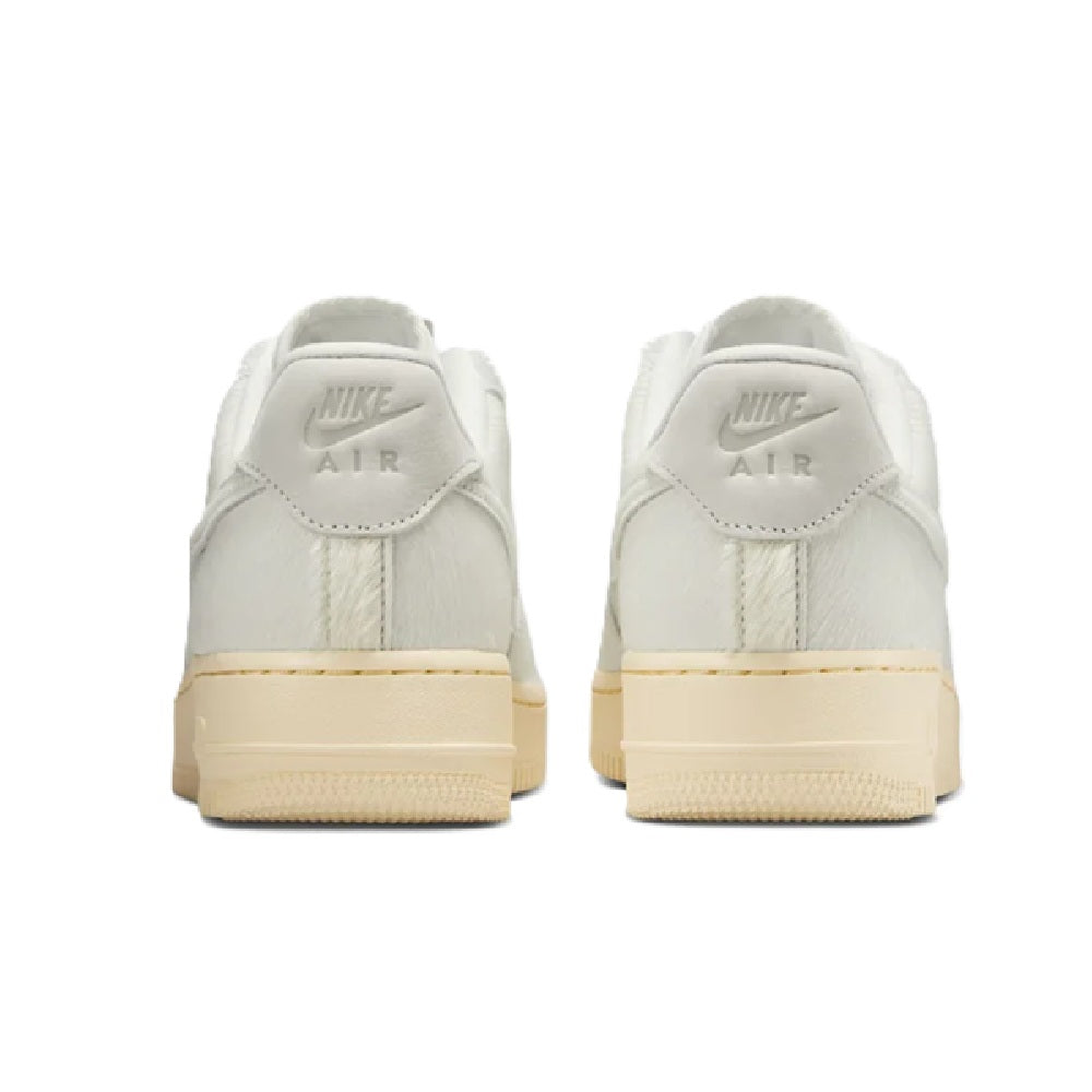 Nike Air Force 1 '07 sneaker pair with heel tab and AIR logo, sail upper, gum sole