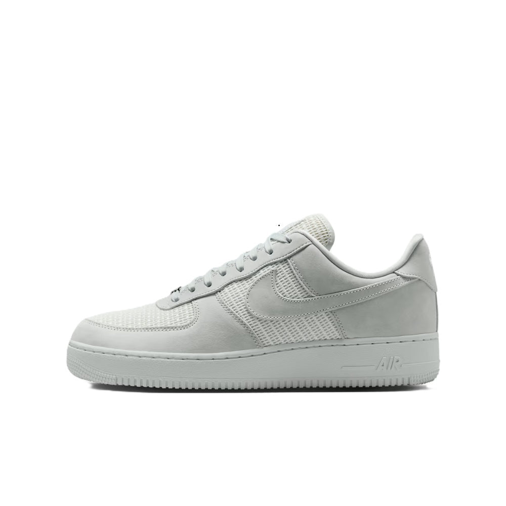 Air Force 1 low-top sneakers, side view with perforated toe and Nike swoosh