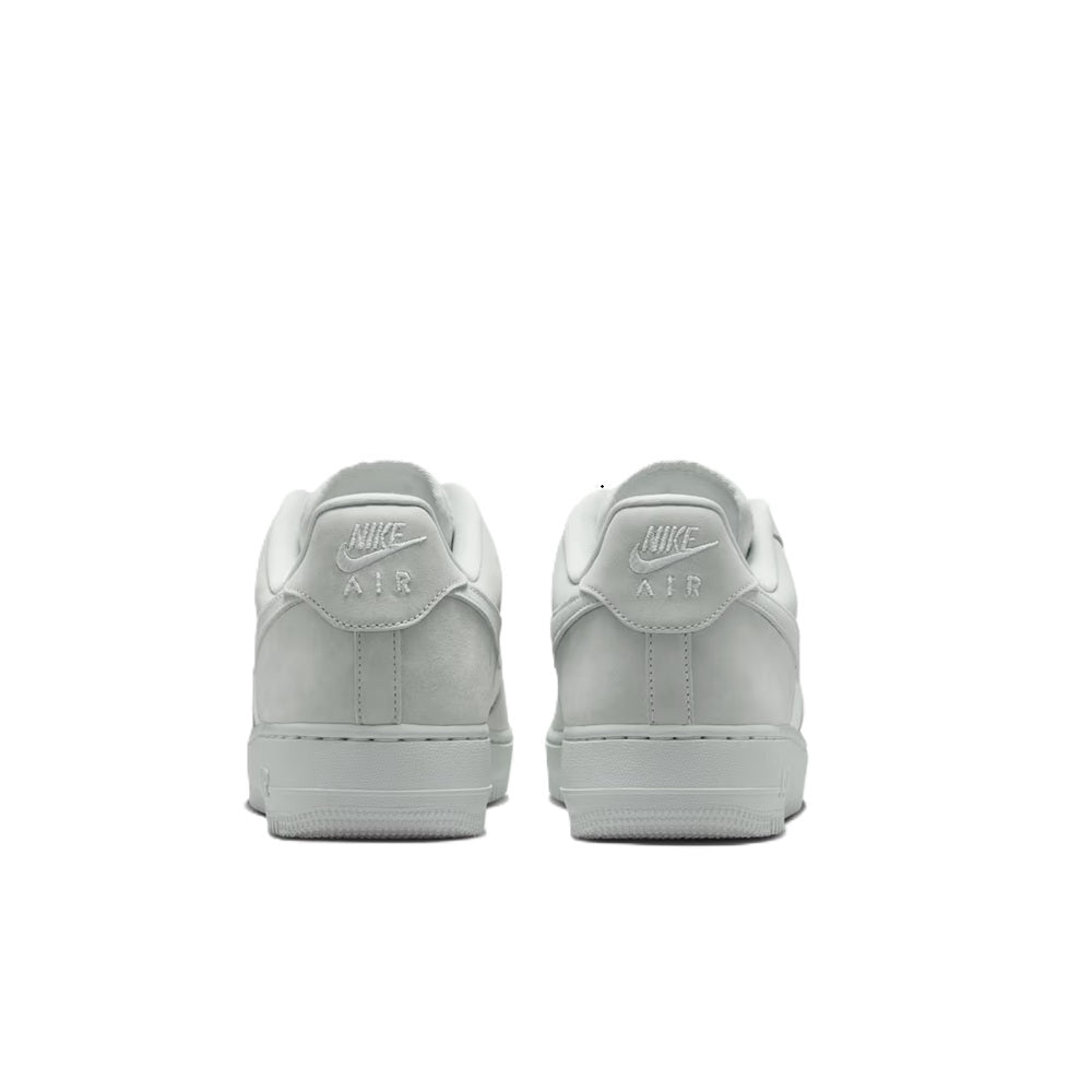 Air Force 1 low-top sneakers, heel view with NIKE AIR branding on back tabs