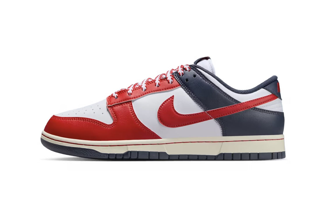 Men's Nike Dunk Low retro sneakers, white with red panels and navy heel