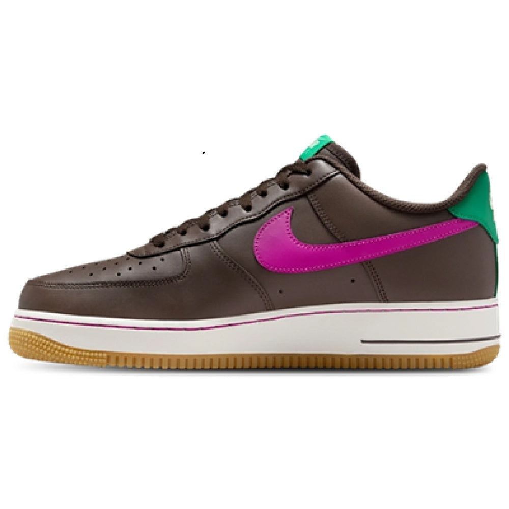 Brown low-top sneakers with magenta side swoosh and green collar lining
